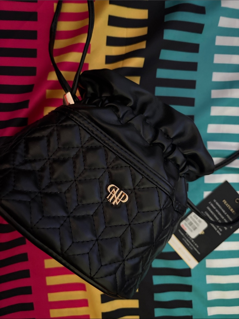Quilted Black Drawstring Jewelry Bag with Gold Tone Logo and little bags